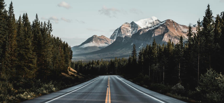 wide road under blue sky