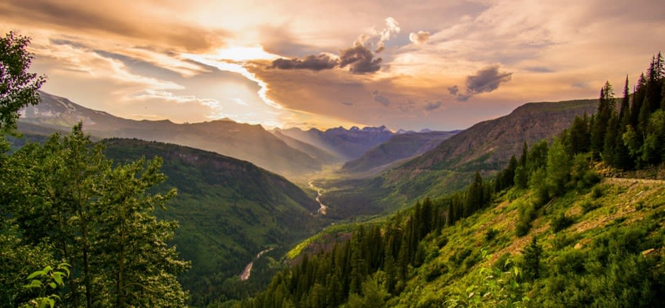 river and mountain ranges under white clouds