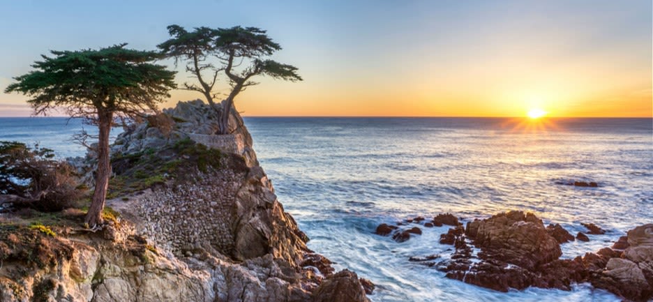 sea waves on rock formation during sunrise